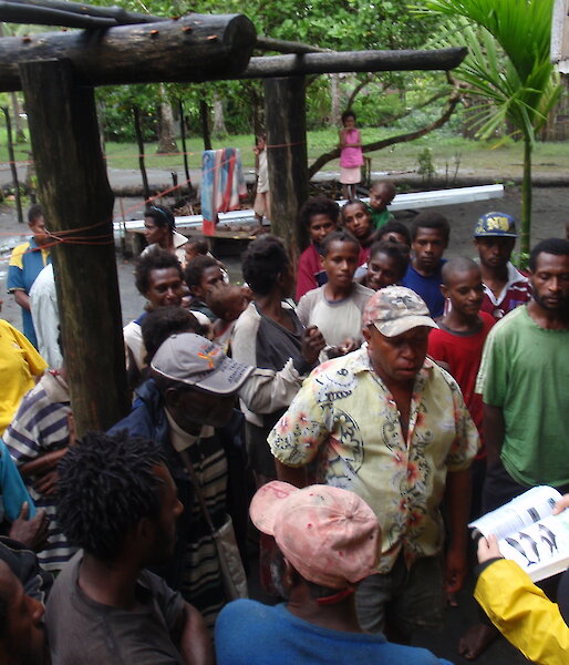 Dr Isabel Beasley conducts a small meeting at Veribari village in the Kikori Delta, to introduce the upcoming dolphin project and describe the dolphin species that occur in the delta.