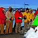 Station Leader Mark Williams conducts the interment ceremony flanked by Mawson expeditioners carrying the ashes of Phil and Nel Law, and the remaining 2011 wintering expedition team.