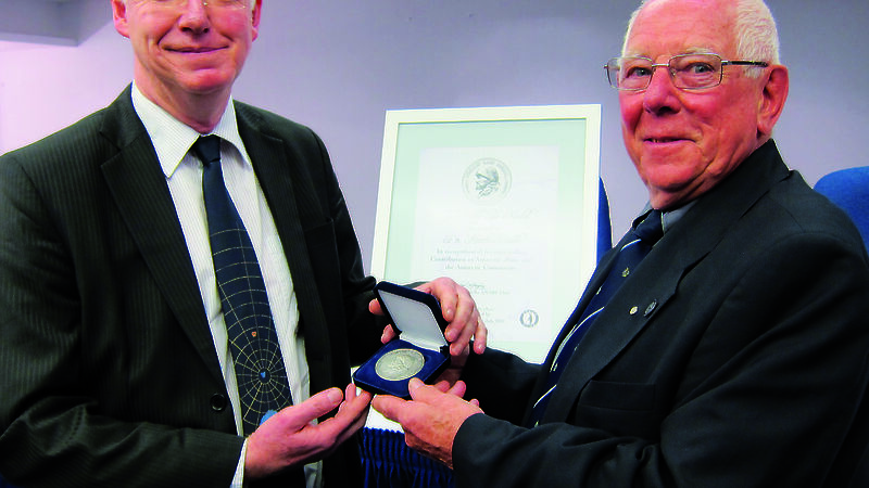 Dr Martin Riddle receives the inaugural Phillip Law Medal from the ANARE club’s Ray McMahon.
