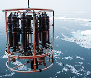 A CTD rosette being lowered into the Southern Ocean to measure conductivity, temperature and depth.