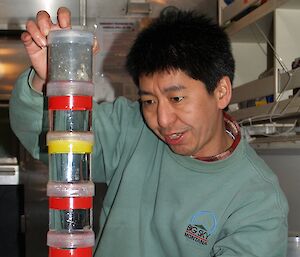 Dr So Kawaguchi with jars of krill collected from the Southern Ocean.