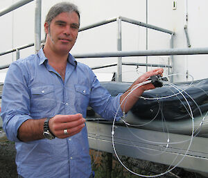 Derek Hamer with the Whale Shield-Jellyfish in its undeployed state.