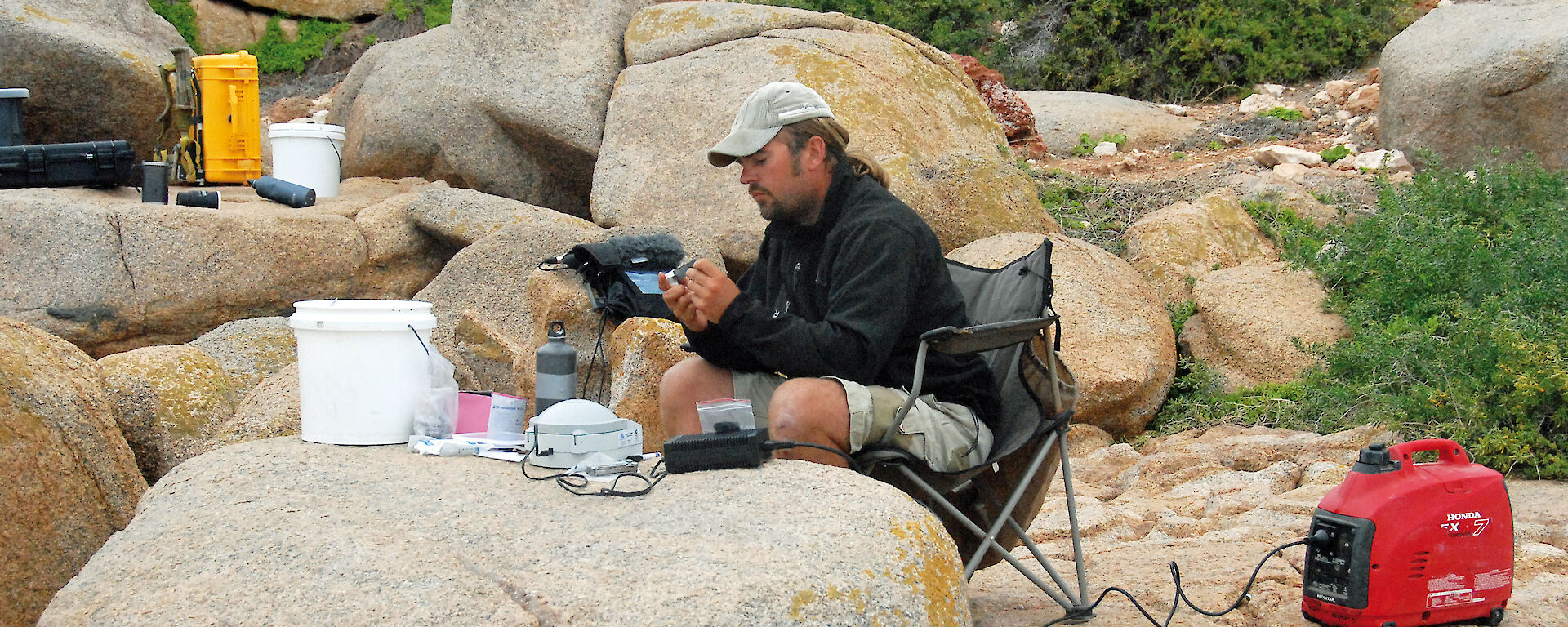 Scientist preparing sea lion blood samples in the field.