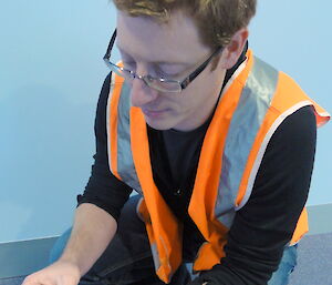 Australian Antarctic Division researcher Chris Ware inspects a pear destined for an Australian Antarctic station.