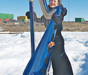 Alice adds some glamour to Mawson station with her electro-acoustic harp on the sea ice.