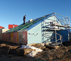 Heritage carpenter, Mike Staples, works on the restoration of Biscoe Hut at Mawson.