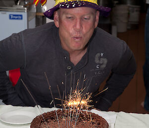 Fearless blowing out the sparkler candles on his birthday cake