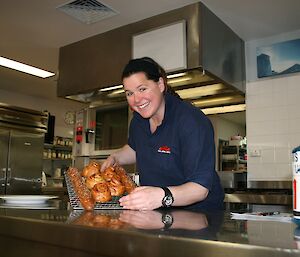 Lisa with a tray of freshly baked ‘cheesy-mite’ scrolls and french sticks