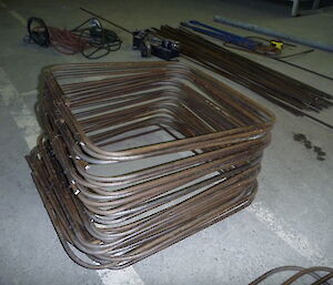A stack of reinforcing steel bent to size