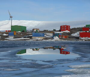 Station reflected in a pool of open water in Horsehoe Harbour