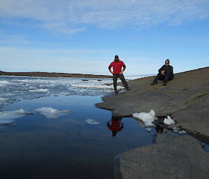 Expeditioners Nick and Tim admire the view of the open water in a tide crack