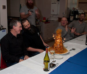 Ken and Mark admire their croquembouche birthday cake