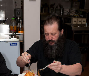 Mark servers up portions from the croquembouche cake