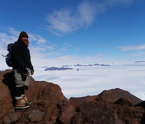 Tim on top of Mt. Henderson, looking towards Fang Peak and Rumdoodle