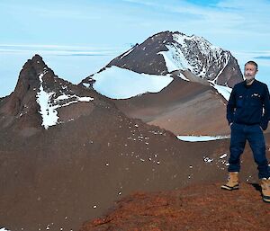 Dave on top of Mt. parsons with Fang Peak in the background