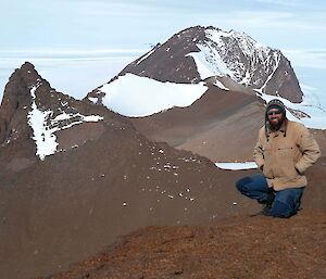 Clint on top of Mt. Parsons with Fang Peak in the background