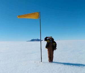 Expeditioner saluting the wind sock