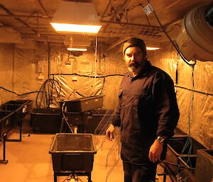 Expeditioner Cotty surveys the emptied hydroponics facility