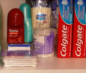 A shelf in Woolies (the self help area) of toothpaste, cotton buds, deodorant, etc