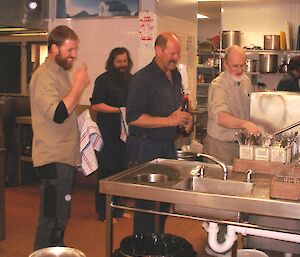 Expeditioners cleaning up the dishes after a meal