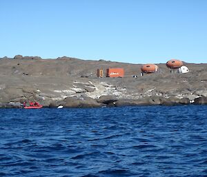 Looking back at Beche Island and huts from the IRB on departure