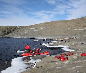 Expeditioners in inflatable rubber boat landing at Welch Island