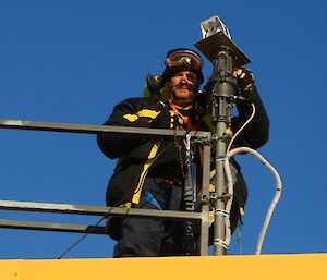 Hendo fitting last bolt to attach new Webcam to the rotator on top of Operations building