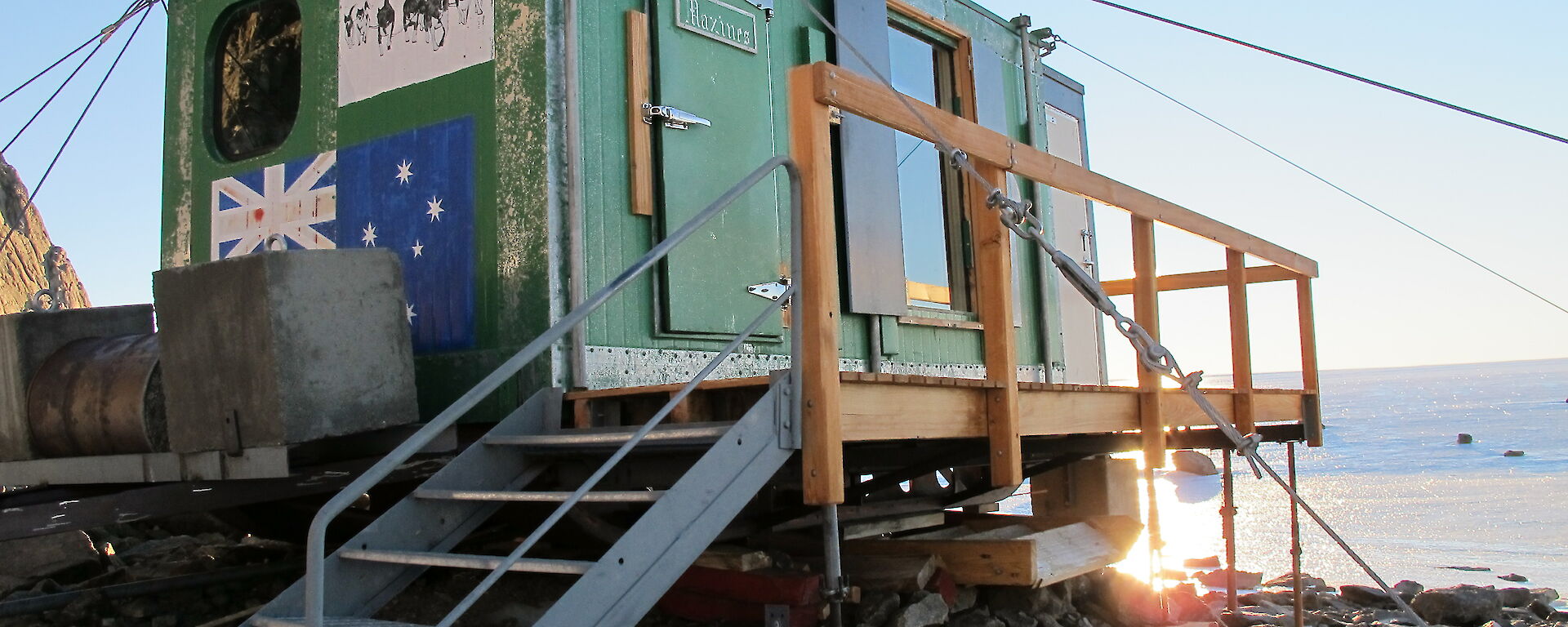 The green field hut stabilised and levelled with refitted guy wires and props.