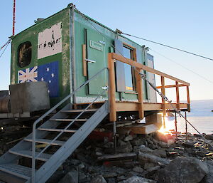 The green field hut stabilised and levelled with refitted guy wires and props.