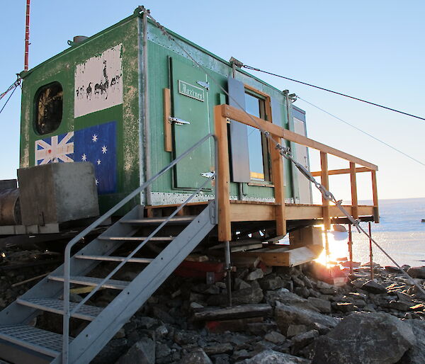 The green field hut stabilised and levelled with refitted guy wires and props.