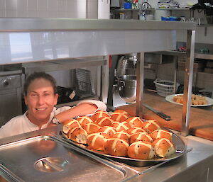 Our chef showing off the hot cross buns she made.