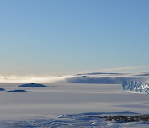 Snow blowing off the ice cliffs to the east of station