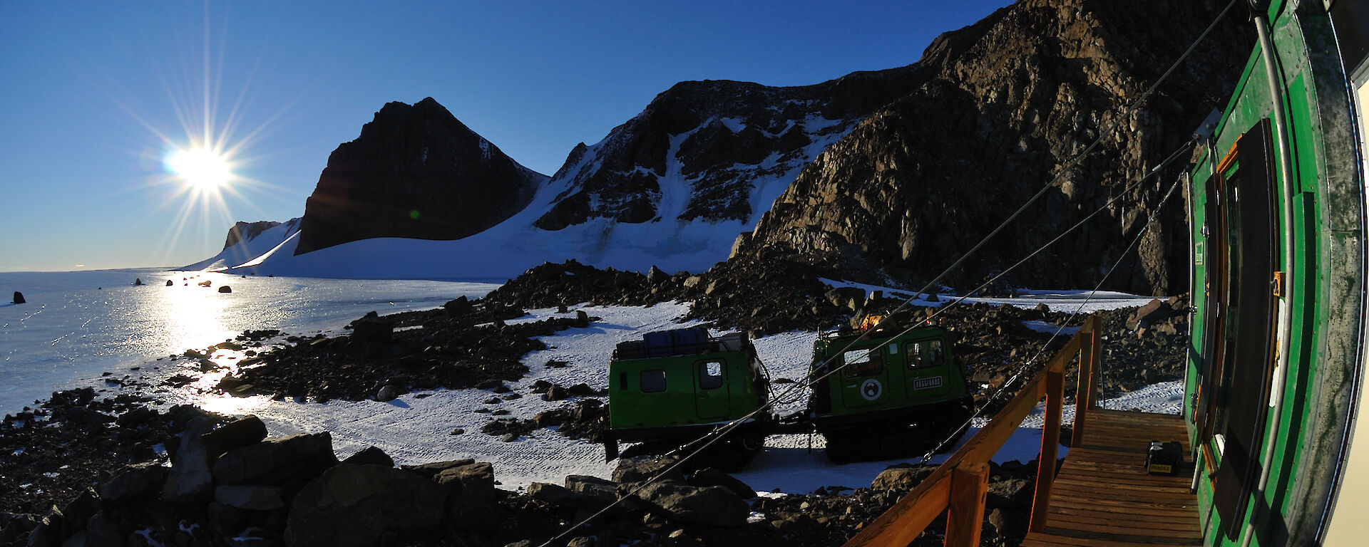 Fisheye photo of Northern Masson Range with green Hägglunds and Rumdoodle hut in foreground