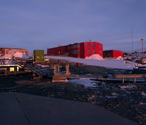 The red evening light highlighting the buildings of Mawson