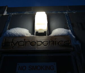 Sign to hydroponics with Icicles hanging off the light above
