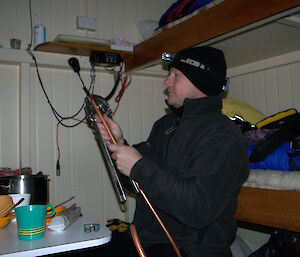 The plumber using pipe benders on the copper gas pipe