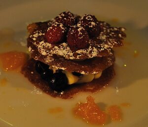 A brandy snap topped and filled with a variety of fruits