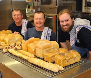 Three expeditioners with the freshly baked bread and scrolls served for morning tea