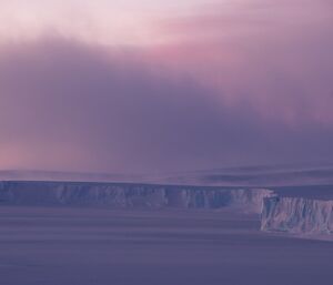 Looking east over East Bay with the wind blowing snow off the plateau