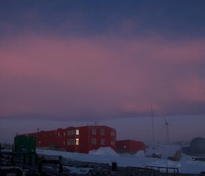 A beautifully coloured red sky with the large sleeping and medical quarters in the foreground