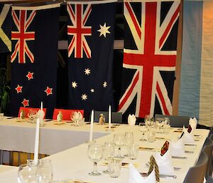 A close up photo of the dinner table and some of flags