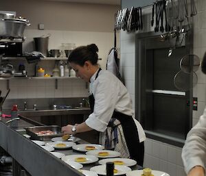 The female chef working efficiently and professionally