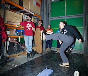 Female expeditioner throwing the glacier boot