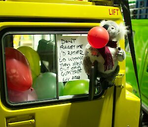 The toy koala named Bear Grylls attached to the window of the tracked vehicle before departure