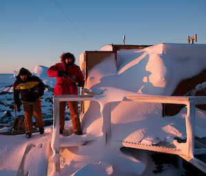 The field hut was covered in snow on our arrival and one of teh expeditioners with a shovel is removing the snow from the verandah