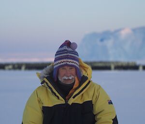 Bob, our Station Leader in front of the Auster colony wearing the hat that Barbara knitted