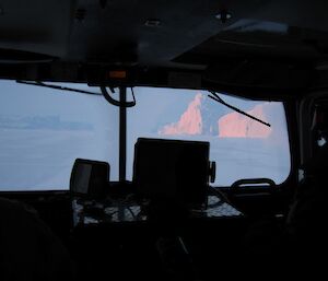 View of icebergs as seen from inside a vehicle