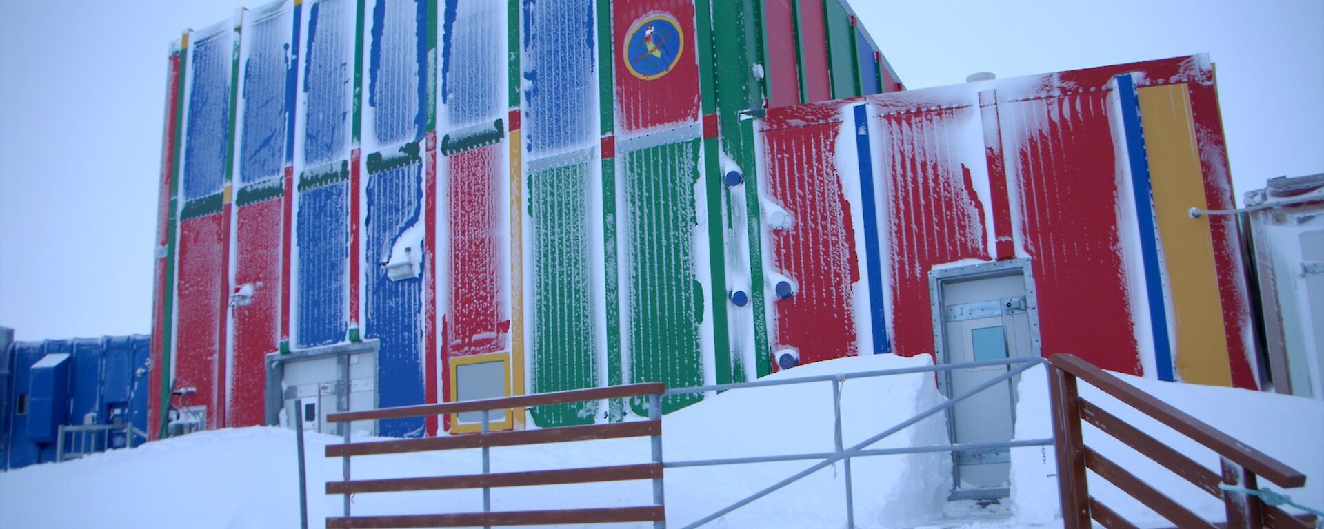The carpenter’s workshop is also called the Rosella Building as its panels are multicoloured as is the Crimson Rosella. Snow is built up on the downwind side of the building