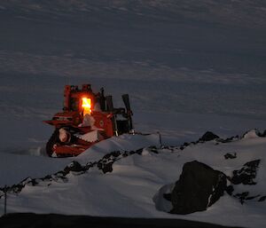 Sunset on the 20th July creating a glow in the cab of the D7 dozer parked on the edge of the ice sheet