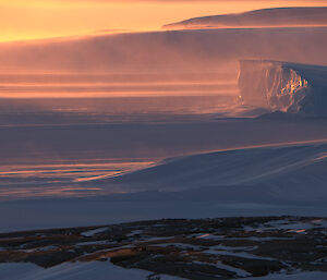 Looking across East Bay with snow blowing off the plateau